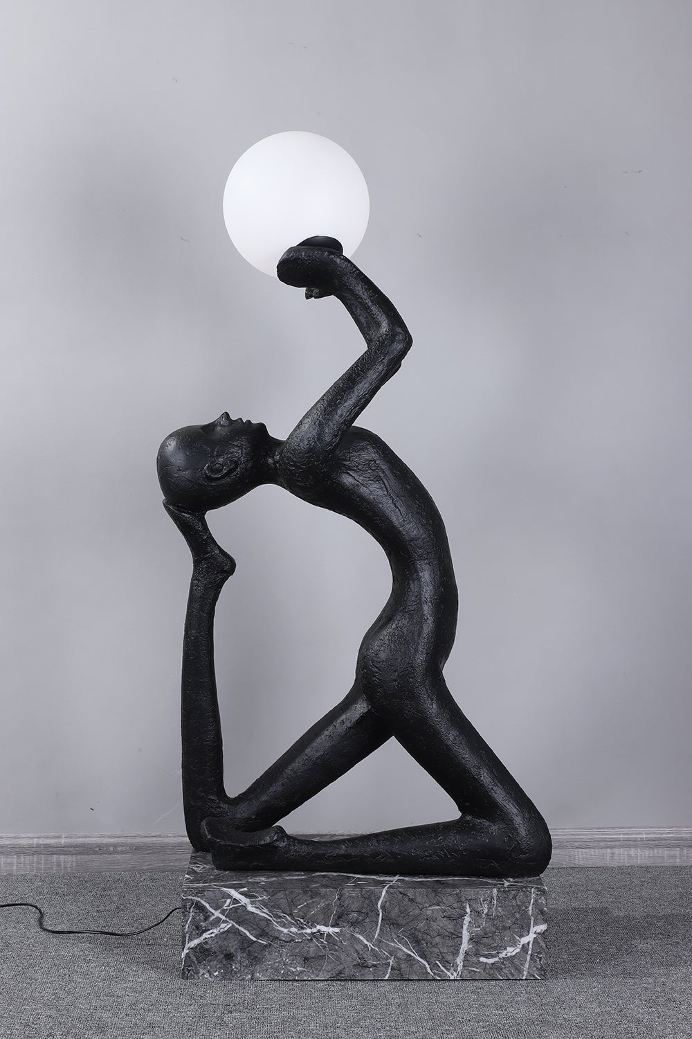 Evvinyra Contorted Black Metal Floor Lamp - Blowlighting