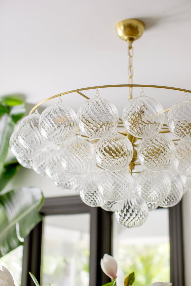 Aurora Chandelier Clear Glass Globe Aged Brass Elegant - Blowlighting
