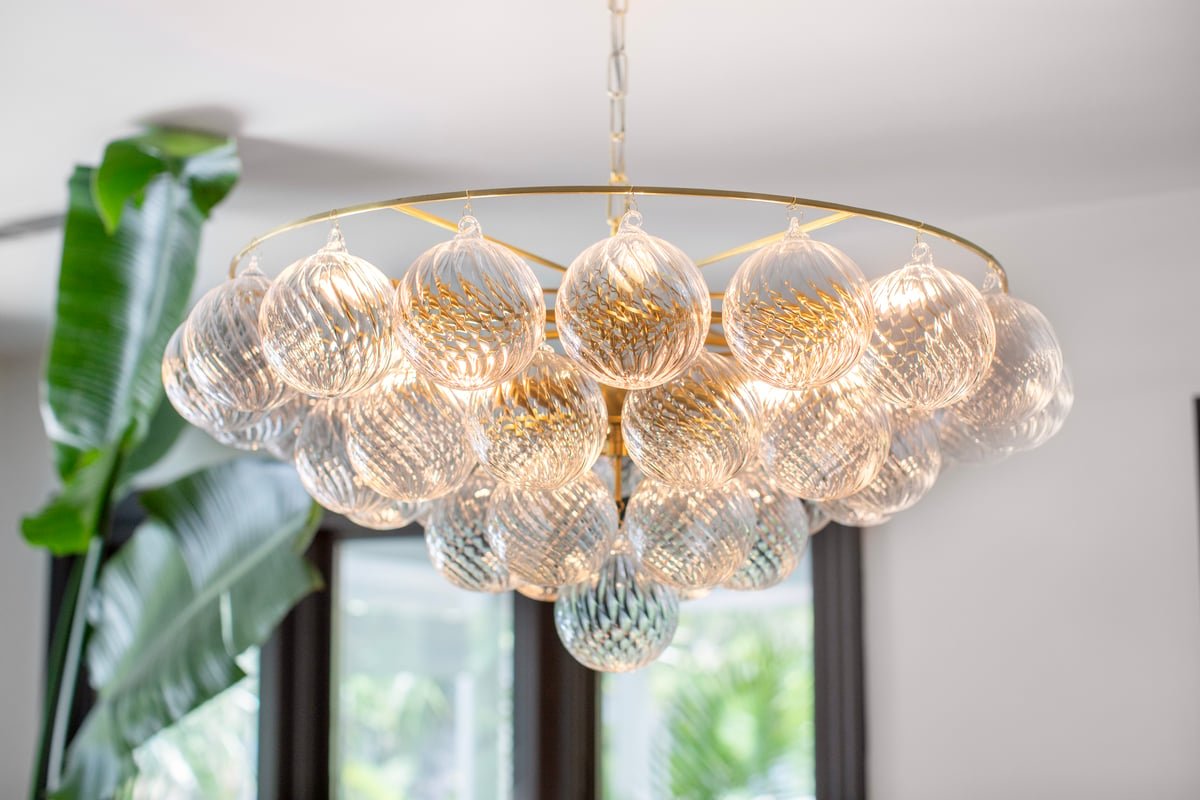 Aurora Chandelier Clear Glass Globe Aged Brass Elegant - Blowlighting